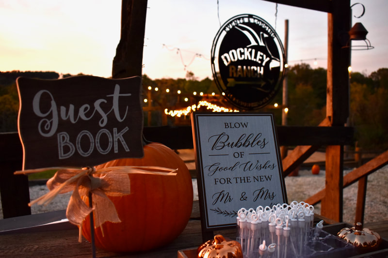 Sign the wedding guest book at Dockley Ranch